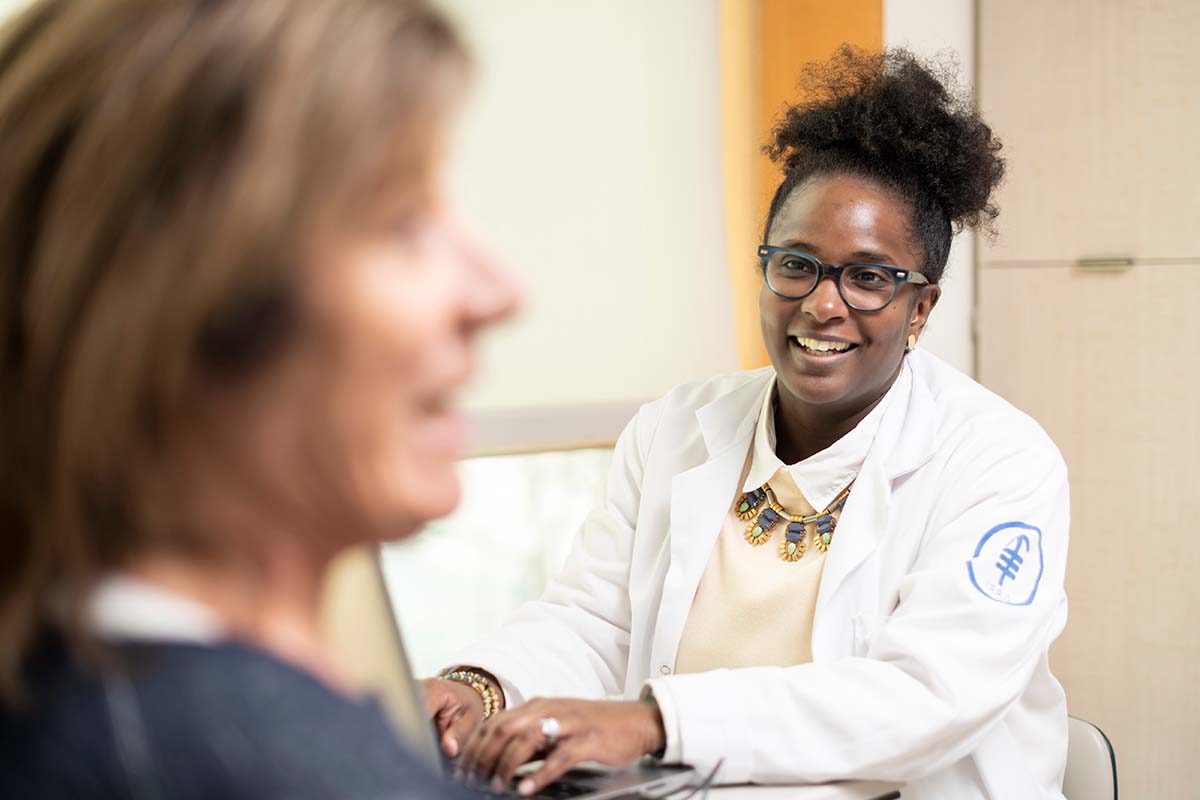 Clinical trials nurse Asia McCoy helps patients learn about new treatments available at MSK. 